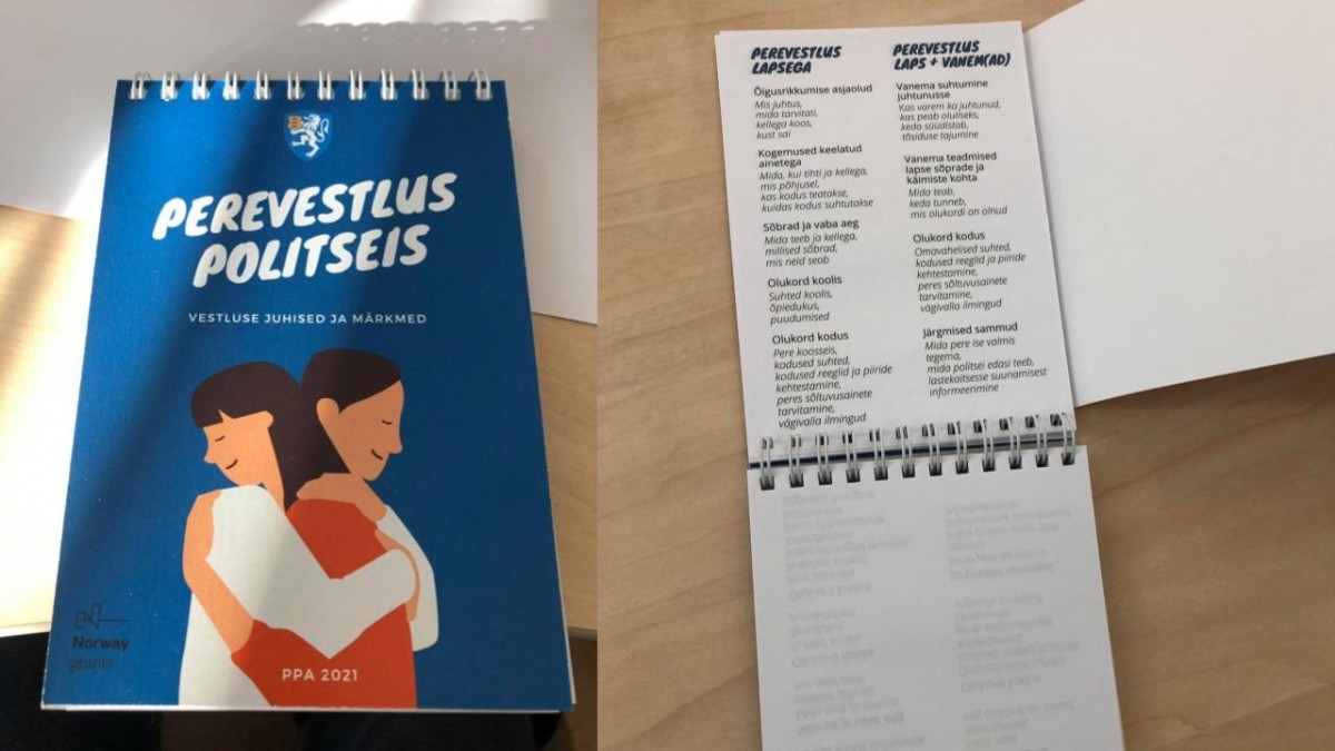 Laud erinevate infomaterjalidega, esiplaanil teatmik Perevestlus politseis
