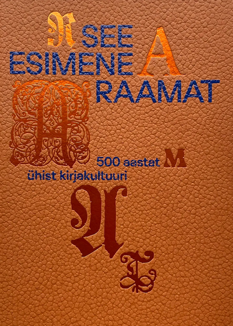 Oranži värvi kaaned, sinine pealkiri.